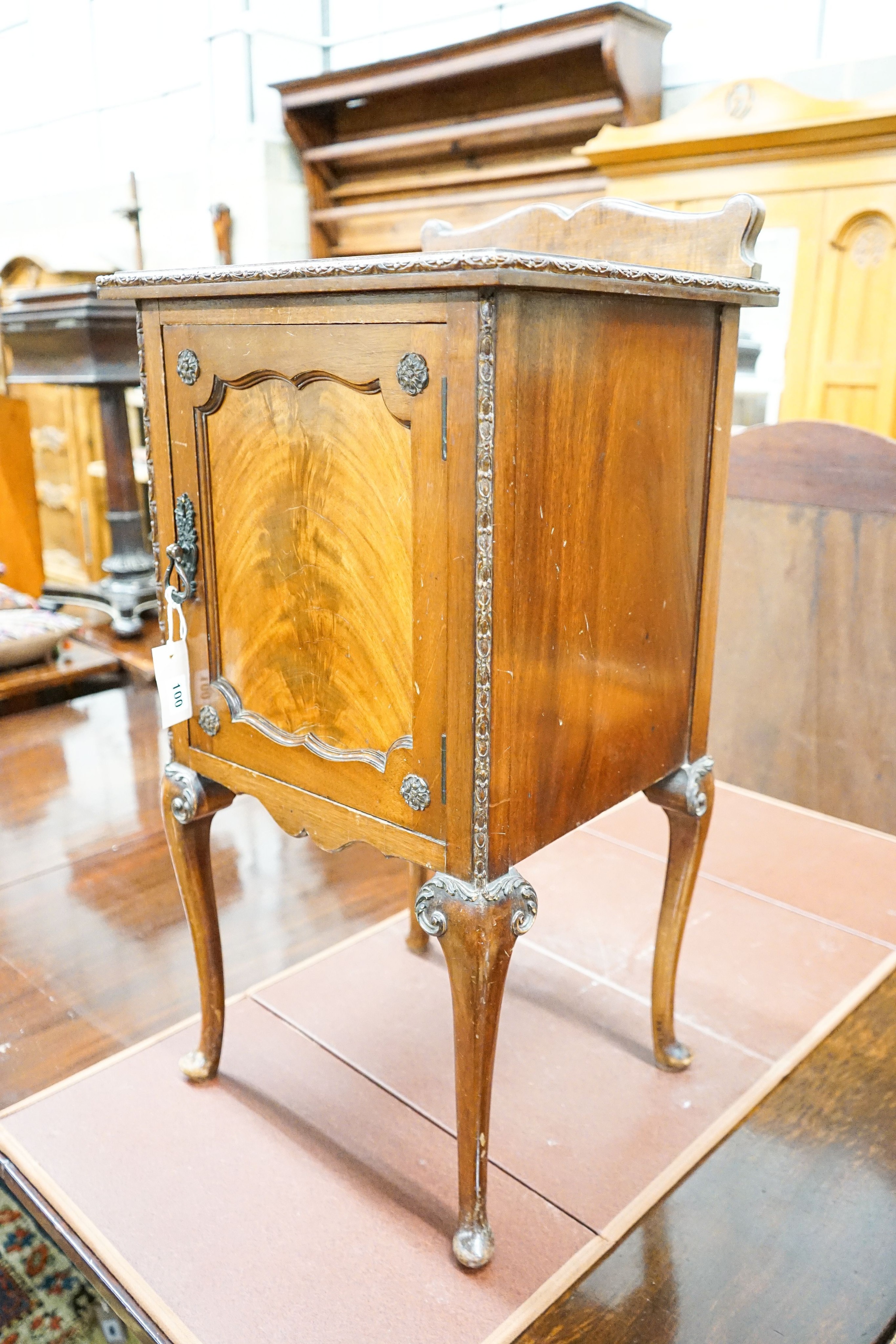 A Queen Anne style carved and figured mahogany bedside cabinet, width 40cm, depth 38cm, height 84cm